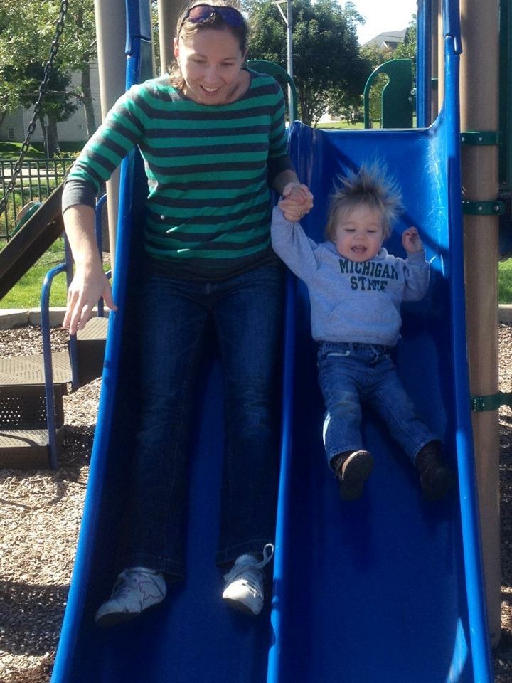 mother and child on slides at the park