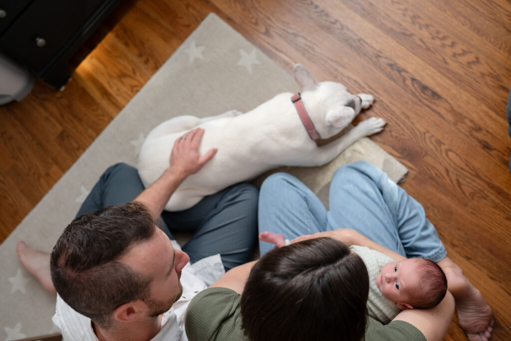Mom wearing jeans for newborn in-home photo session.