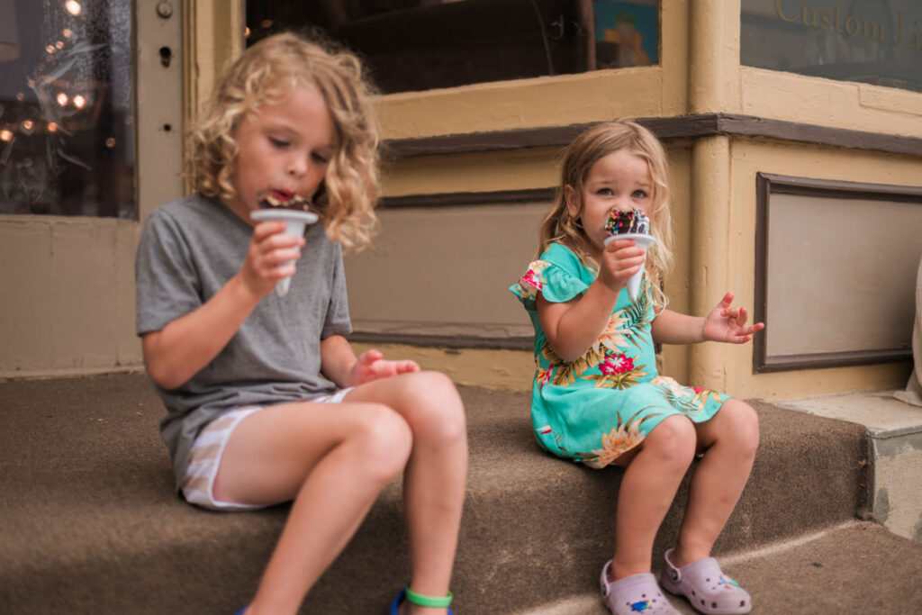 Kids enjoying ice cream during a family beach session in Frankfort