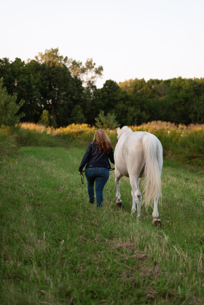 Horse and rider sharing a quiet evening walk around the farm.