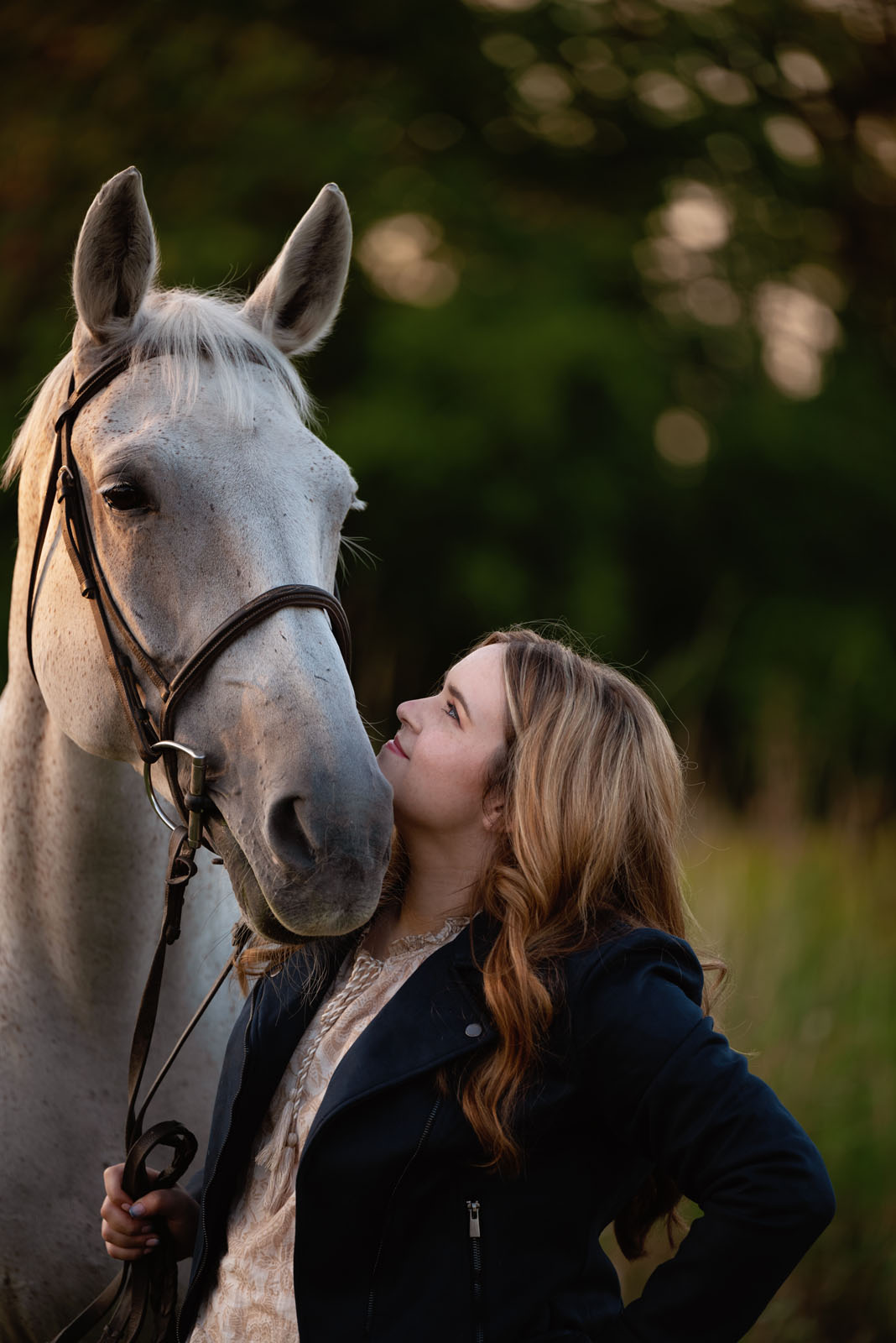 Golden hour photo session capture the magic of the horse and rider bond.