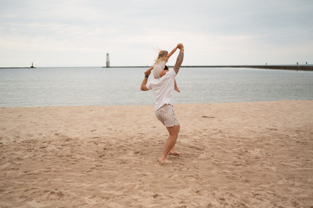 Father and daughter enjoying playing during a family photography session in Frankfort.
