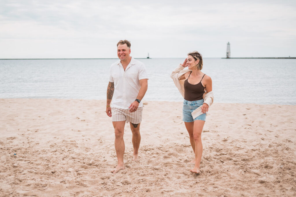 Parents spending a moment enjoying themselves during a family beach photo session.